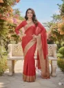 Red saree featuring intricate golden zari work
